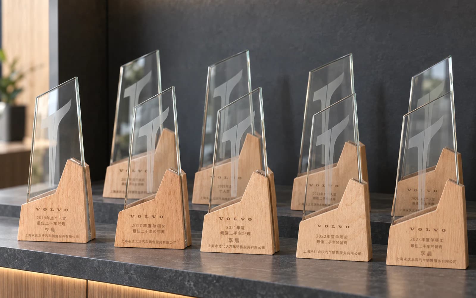 A collection of Volvo used-car awards displayed together